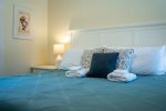 Let the Calm Hues and Beachy Blues of the King Bedroom Lull You to Sleep